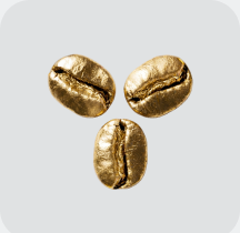 Trois grains de café dorés